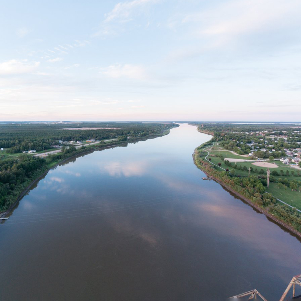 Aerial view of the Saskatchewan River with The Pas and OCN on each side.